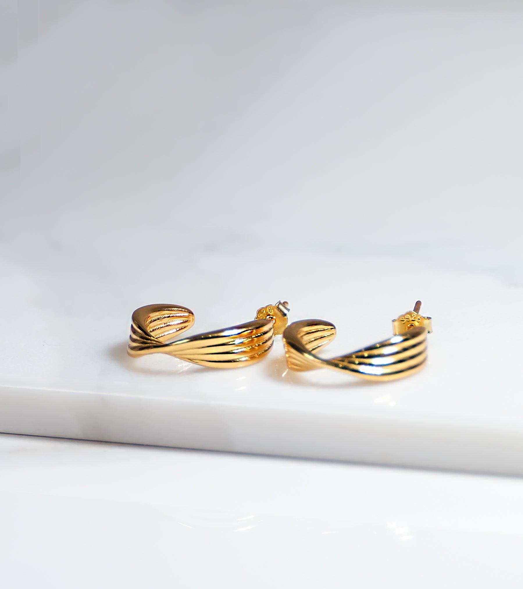 Modern Twist Gold Colour Earrings