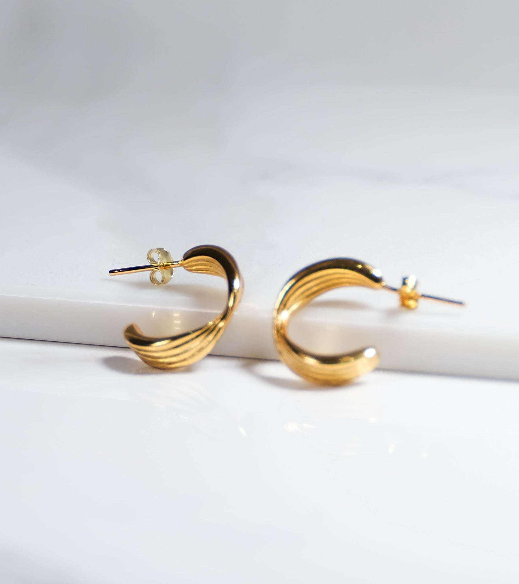 Modern Twist Gold Colour Earrings