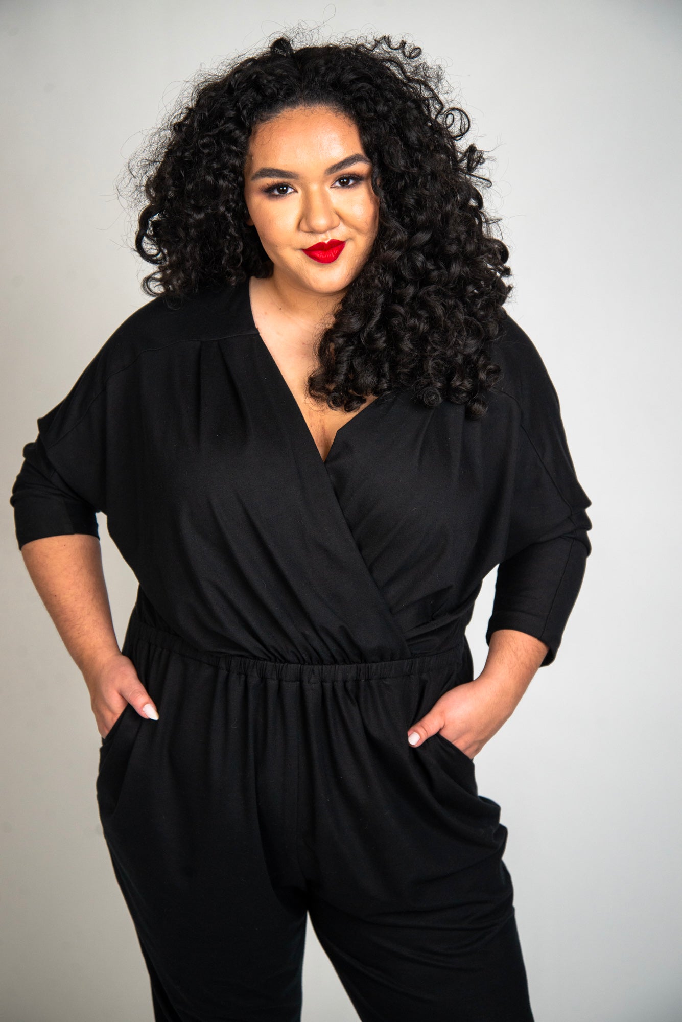 Mayes NYC Alex Back to Front Reversible Jumpsuit Solid color black worn by model Grace Delgado