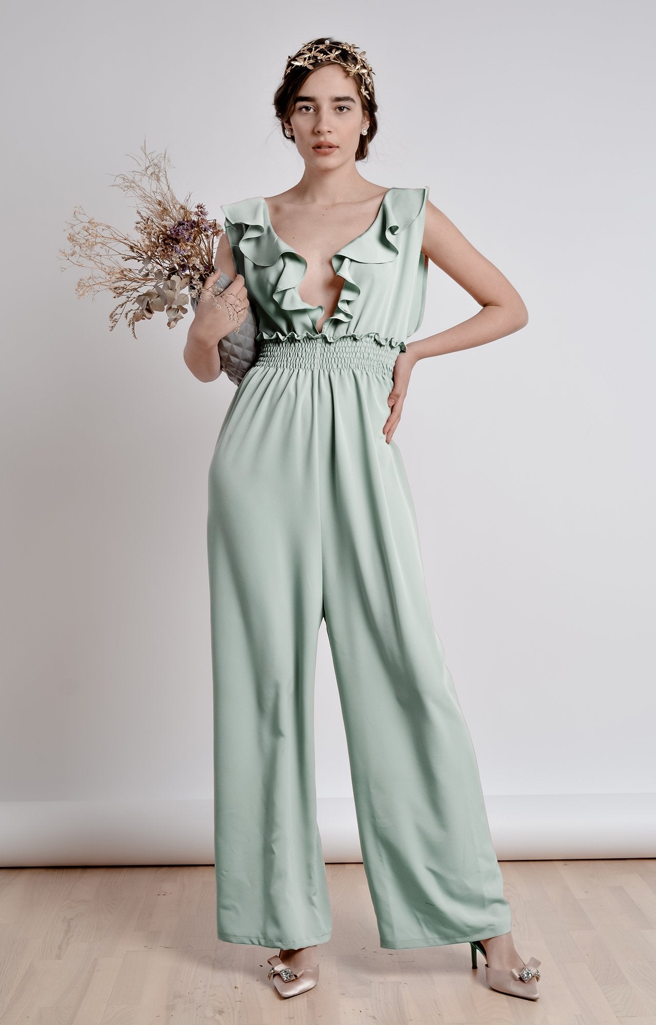 Mint green wide leg, sleeveless jumpsuit with ruffle and smocking details