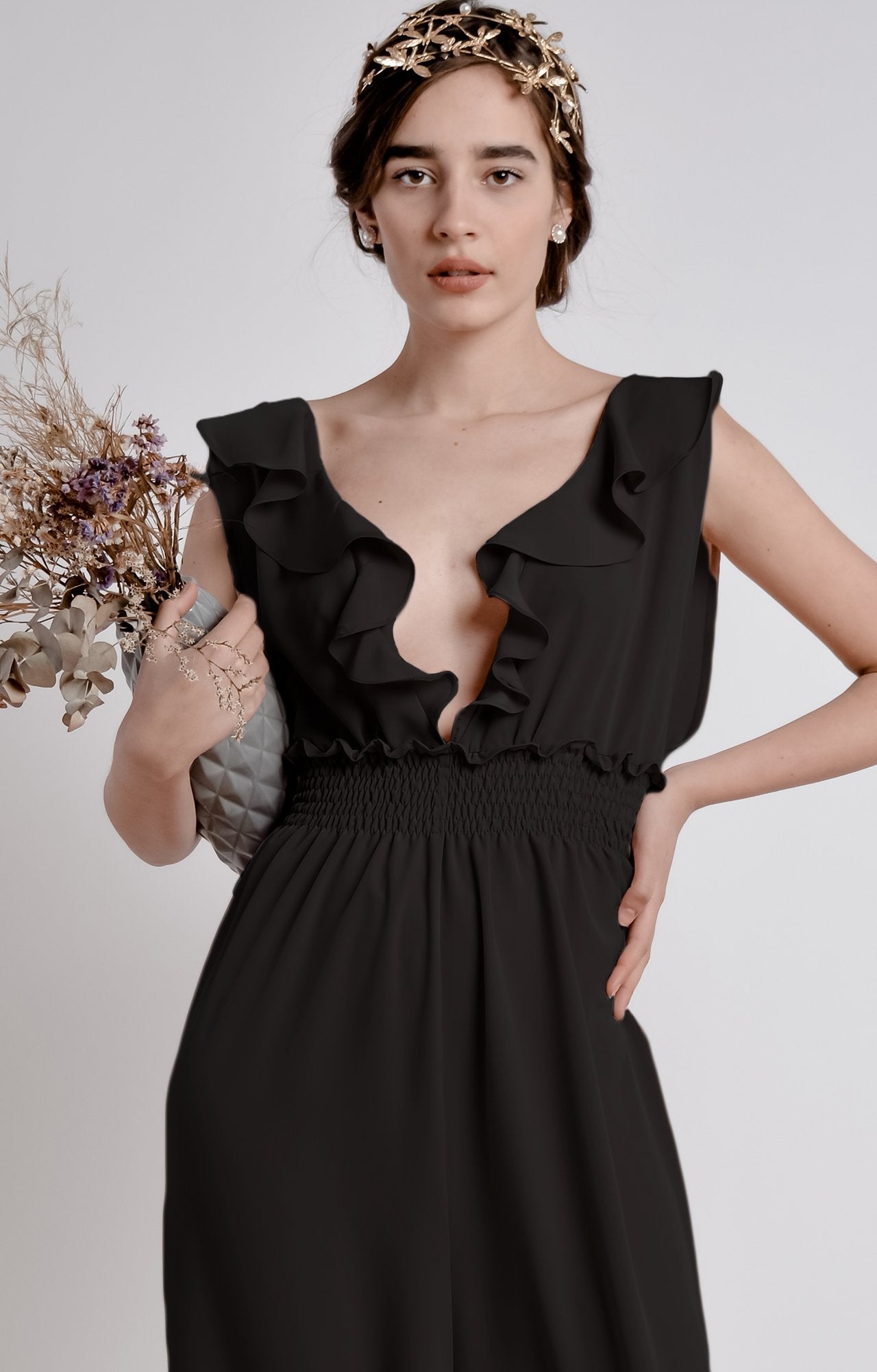 Black wide leg, sleeveless jumpsuit with ruffle and smocking details