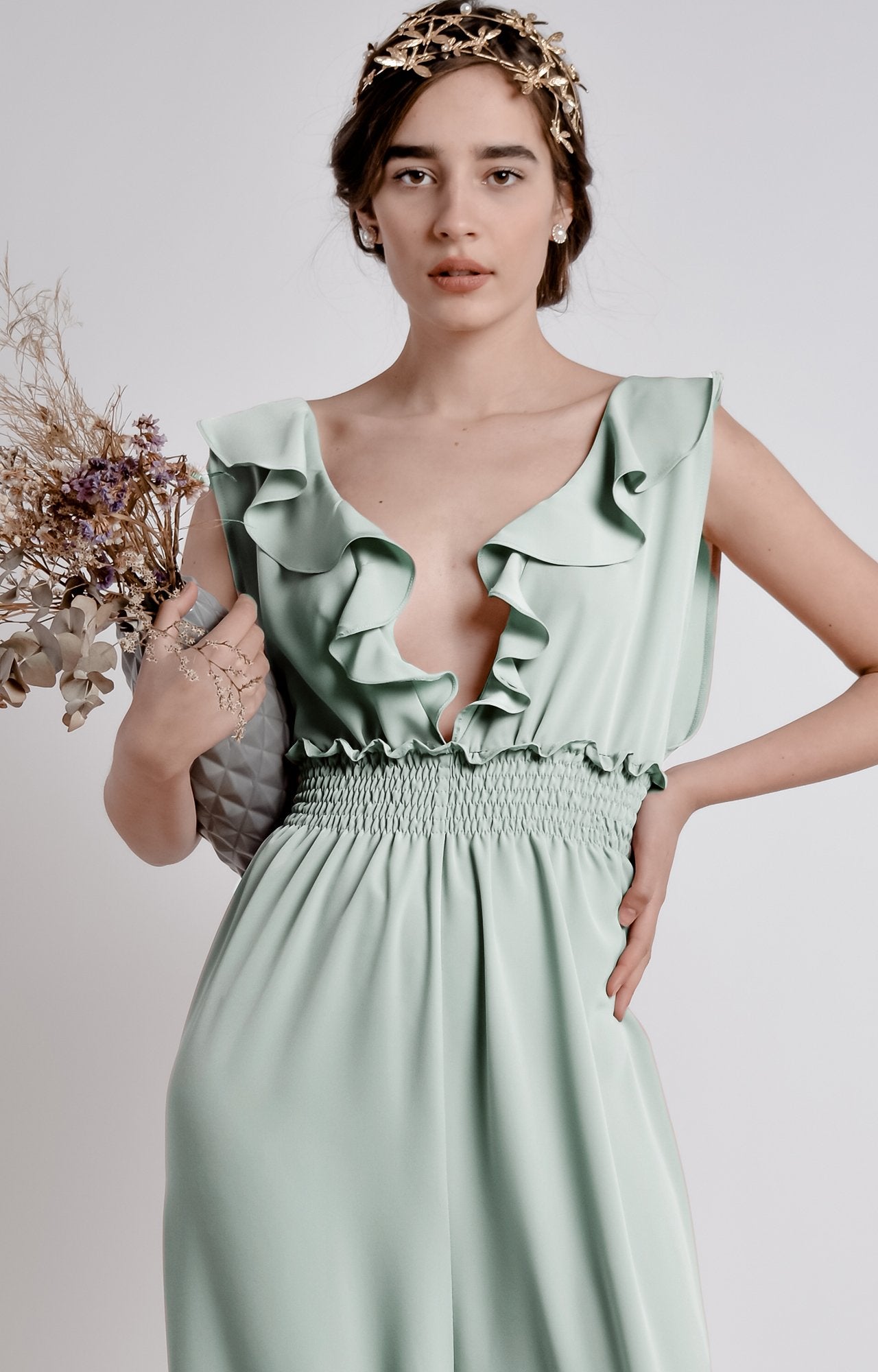Mint green wide leg, sleeveless jumpsuit with ruffle and smocking details