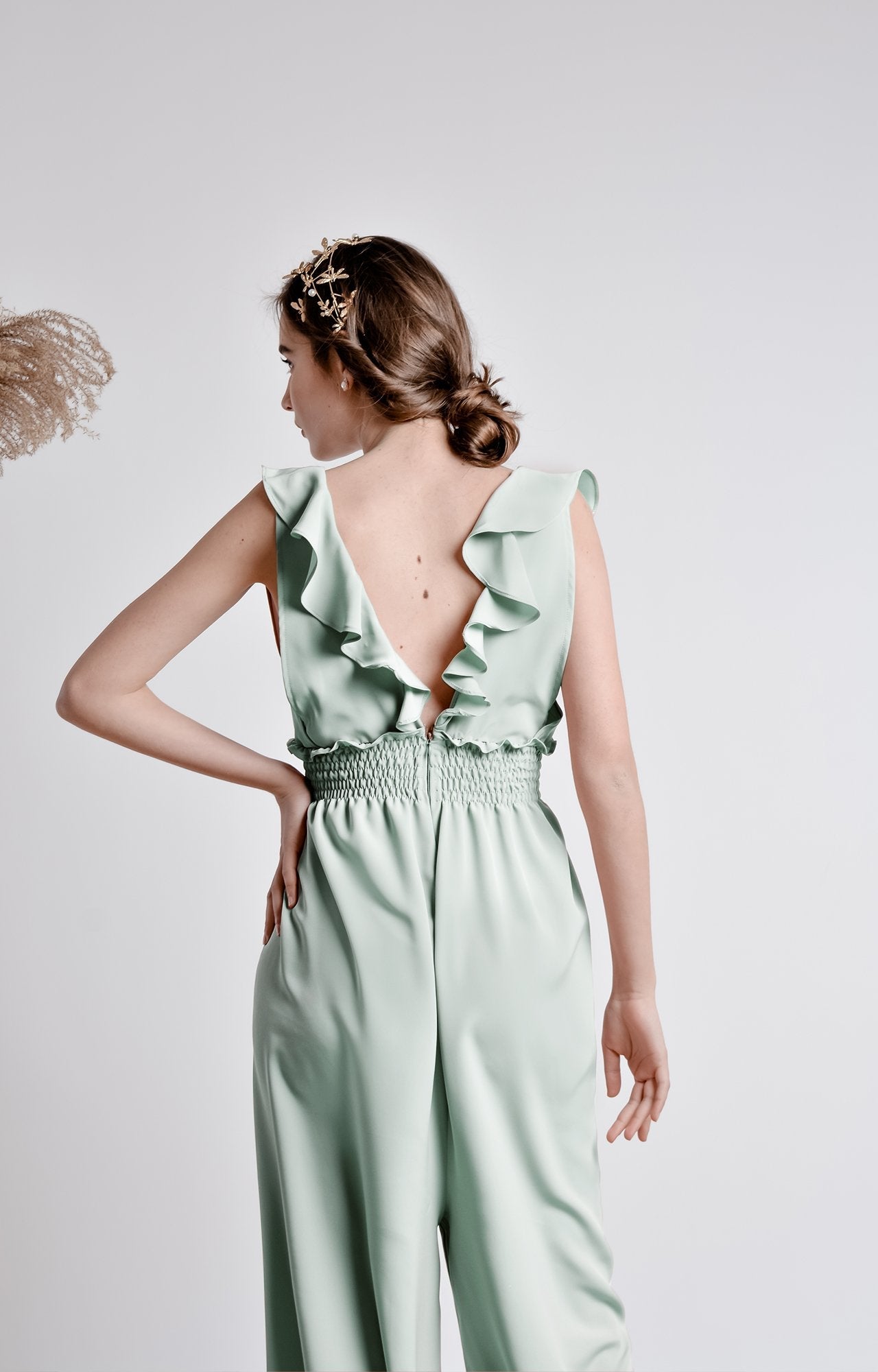 Mint green wide leg, sleeveless jumpsuit with ruffle and smocking details