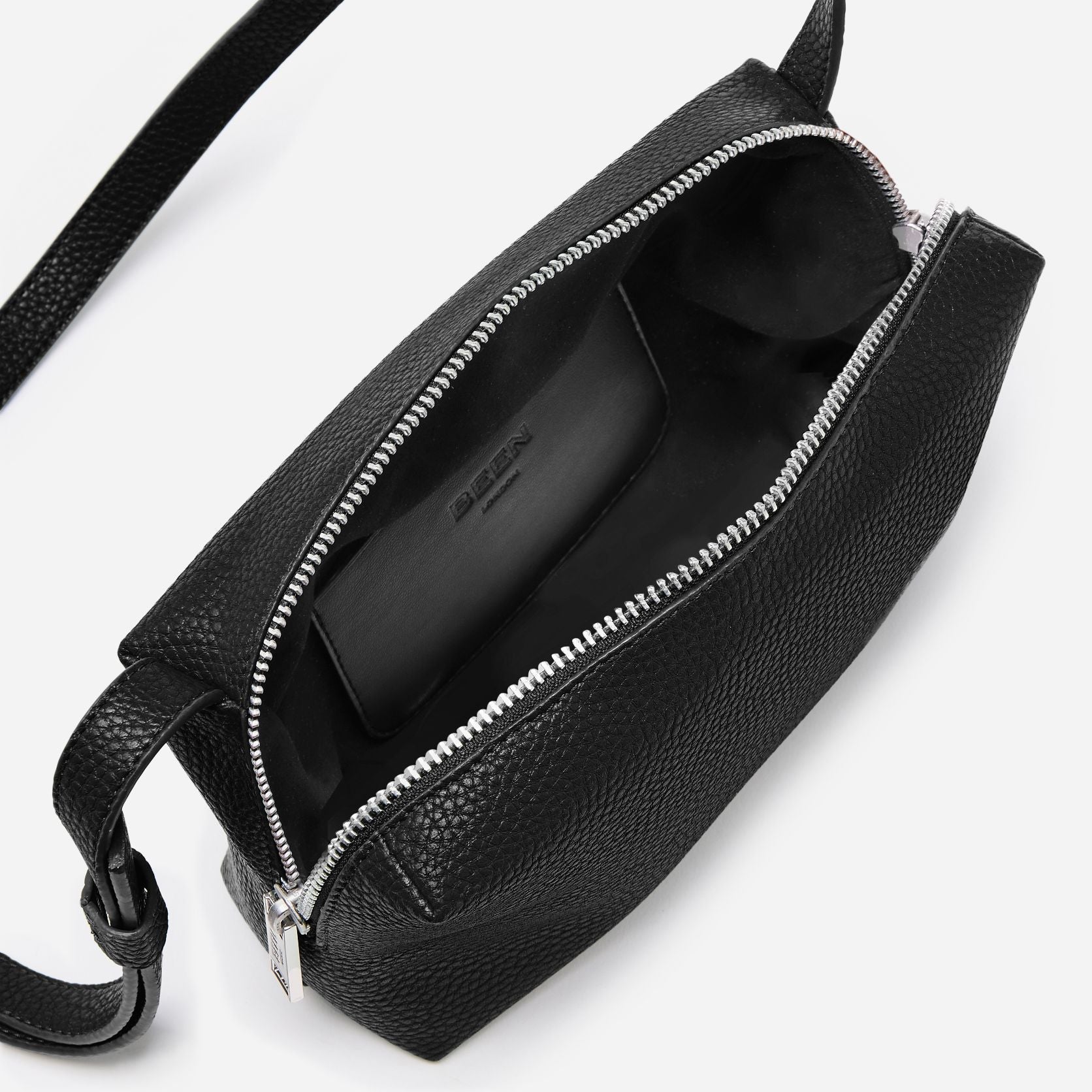 Interior of Rees Pebbled Recycled Leather Camera Bag in Black Onyx showing suede-like lining and handy internal pocket