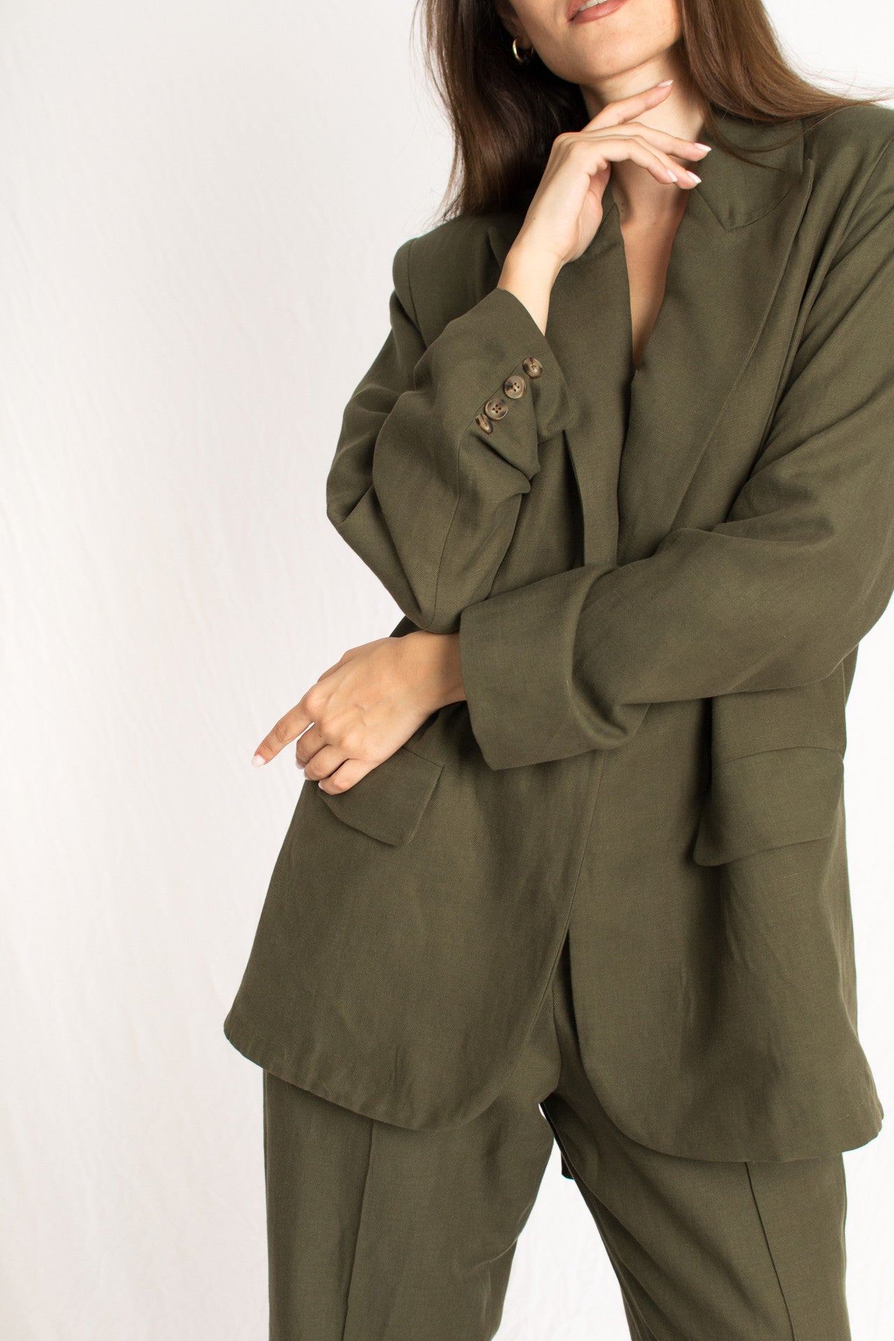 olive green blazer with front button and two pockets