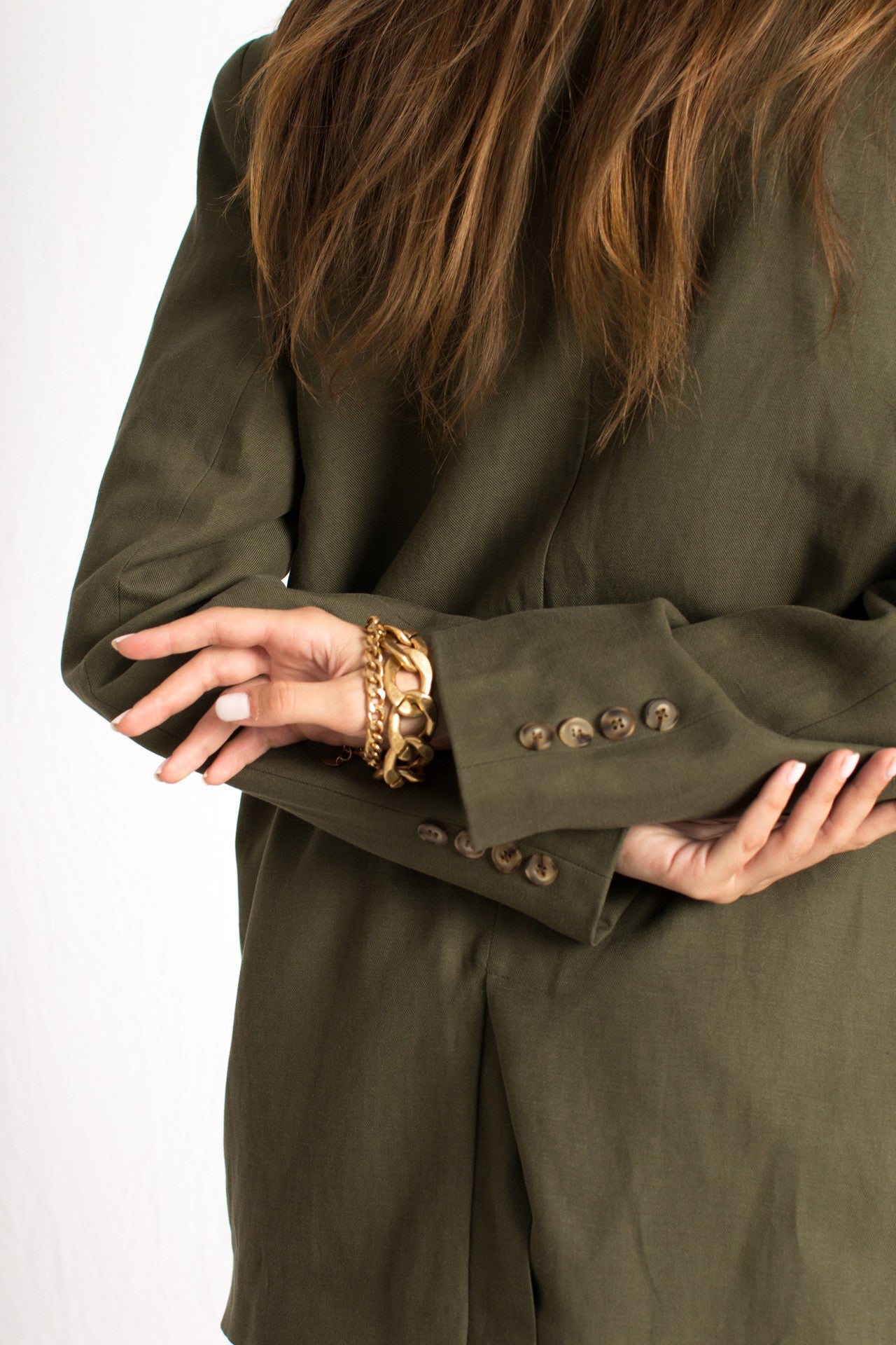 olive green blazer with front button and two pockets