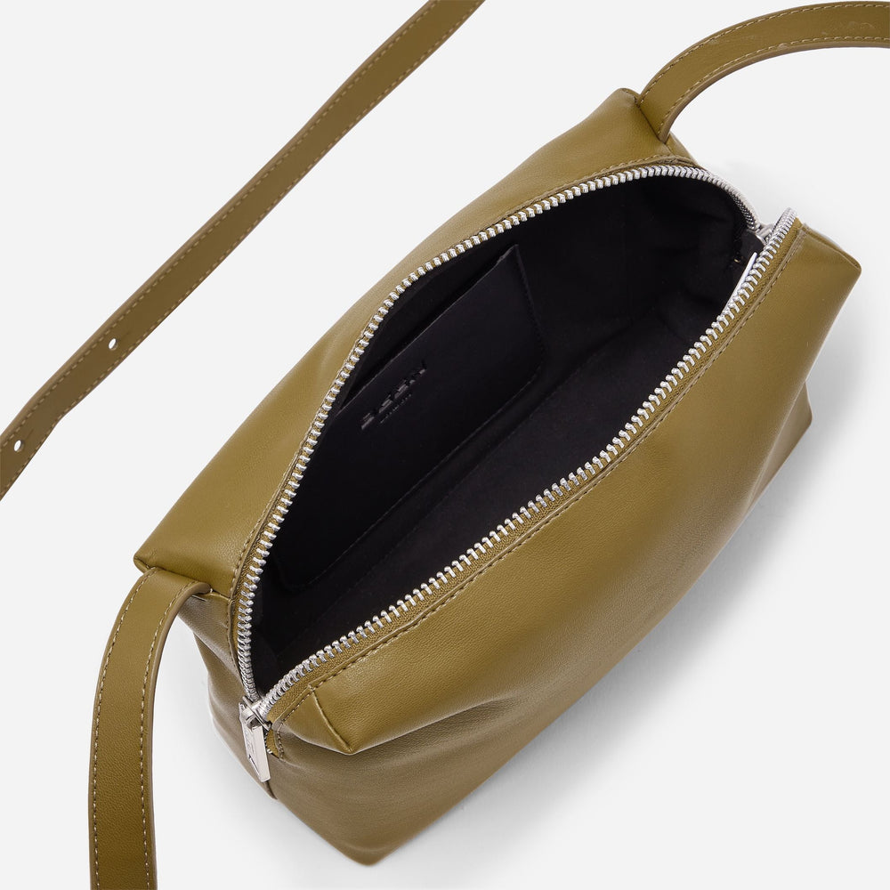 Interior of Rees Recycled Leather Camera Bag in Moss showing handy internal pocket