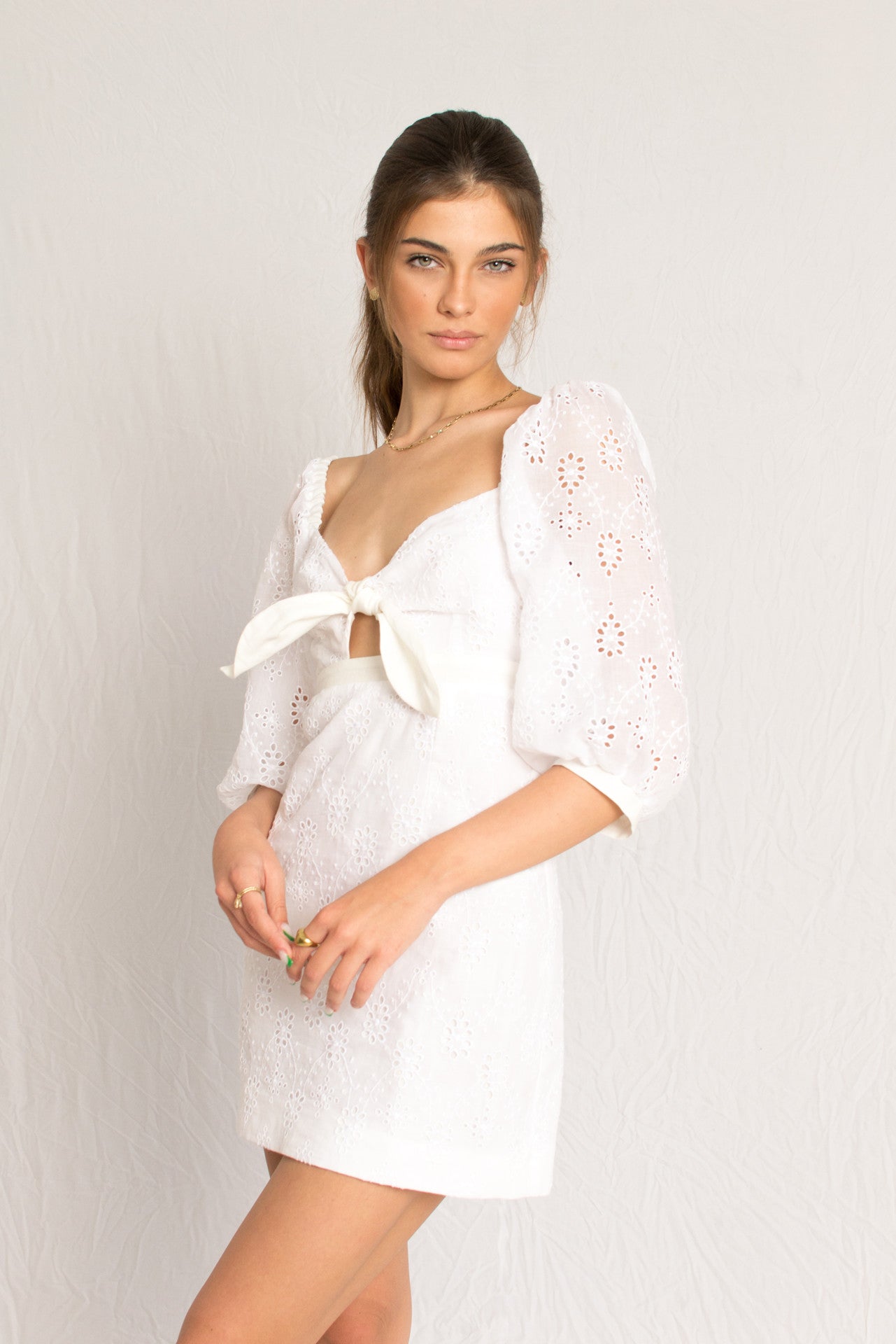 Short white mini dress with peasant sleeves and dainty embossing