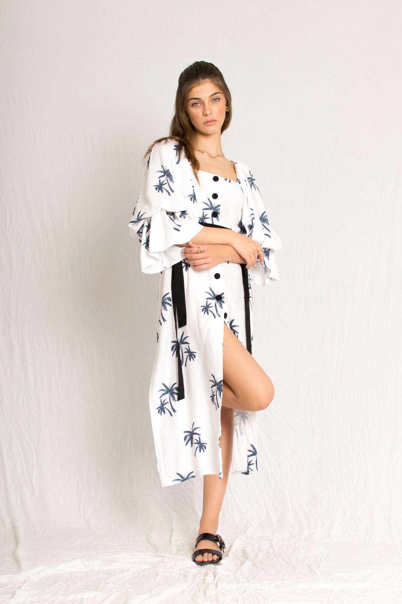 white midi palm tree print dress with side slits and peasant sleeves