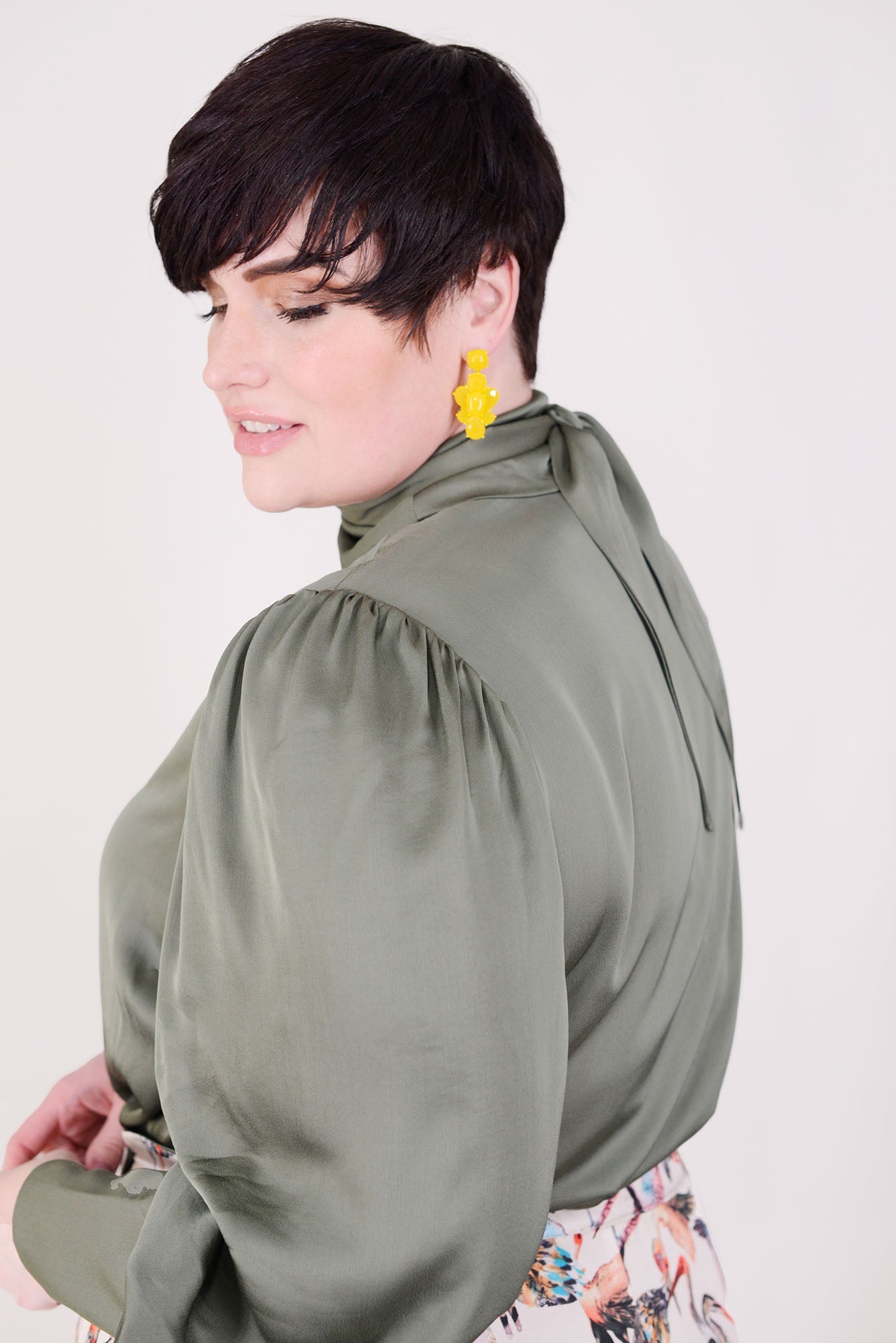 Mayes NYC Mia Scarf Neck Blouse in Solid color Olive worn by model Max