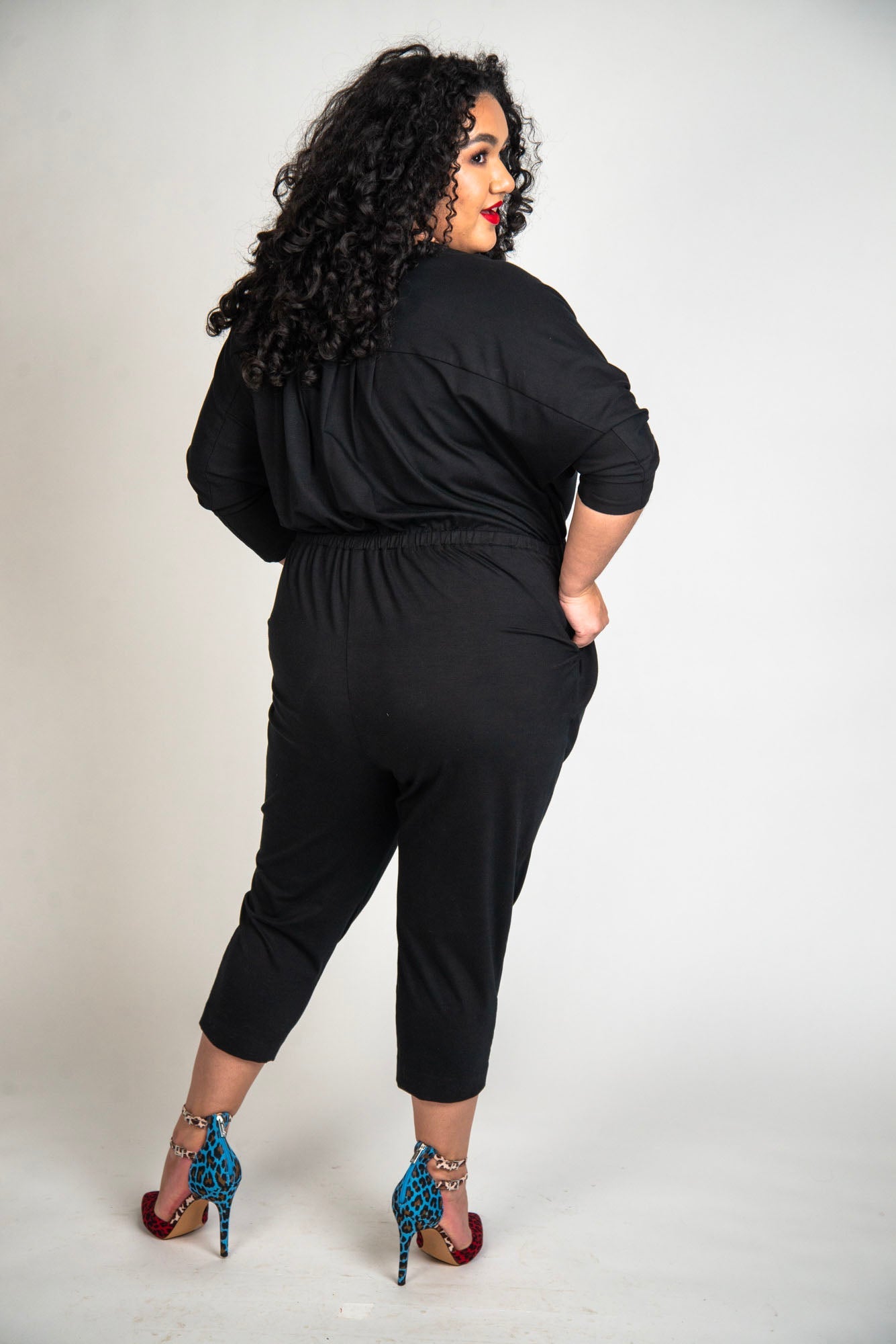 Mayes NYC Alex Back to Front Reversible Jumpsuit Solid color black worn by model Grace Delgado