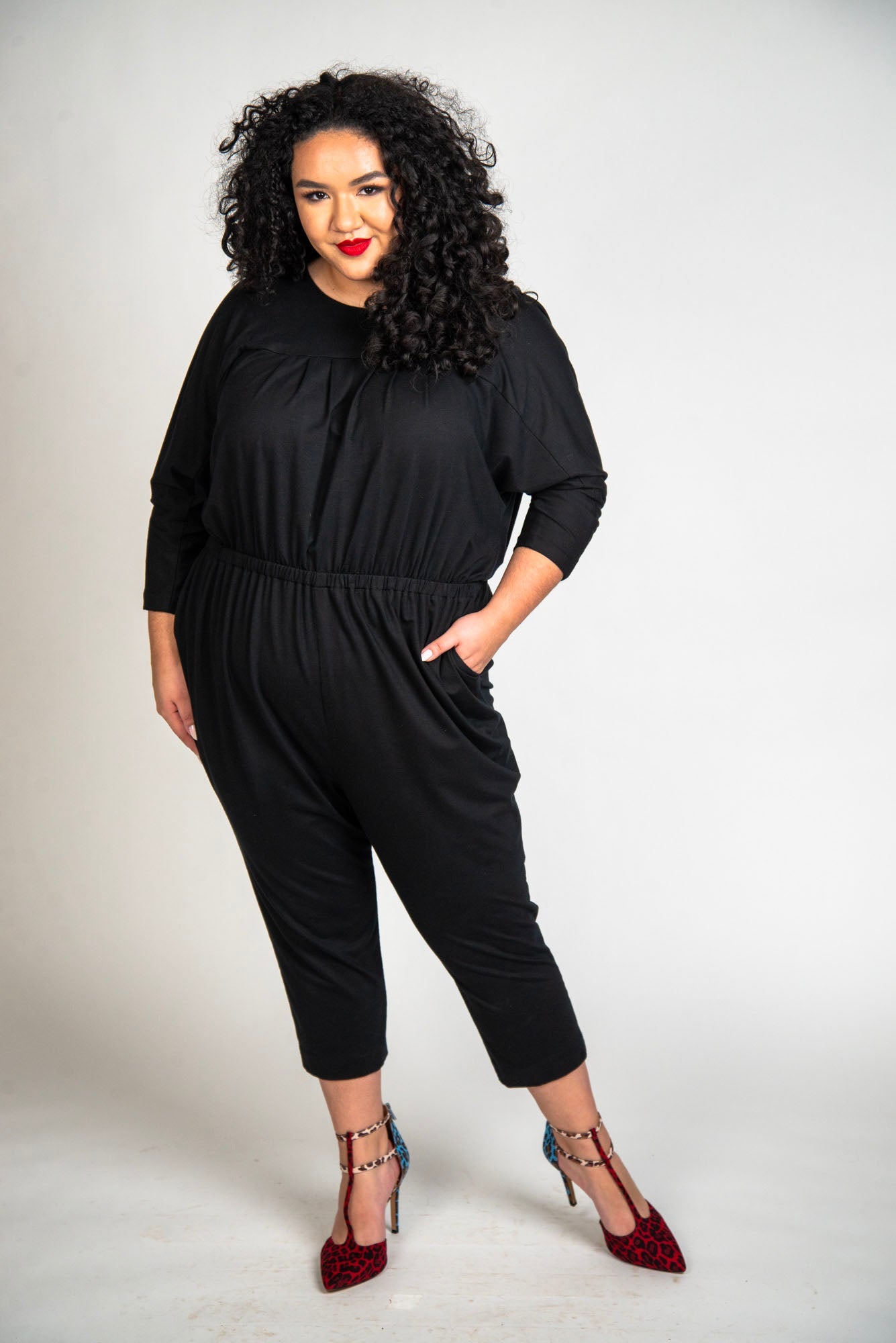 Mayes NYC Alex Back to Front Reversible Jumpsuit Solid color black worn by model Grace Delgado