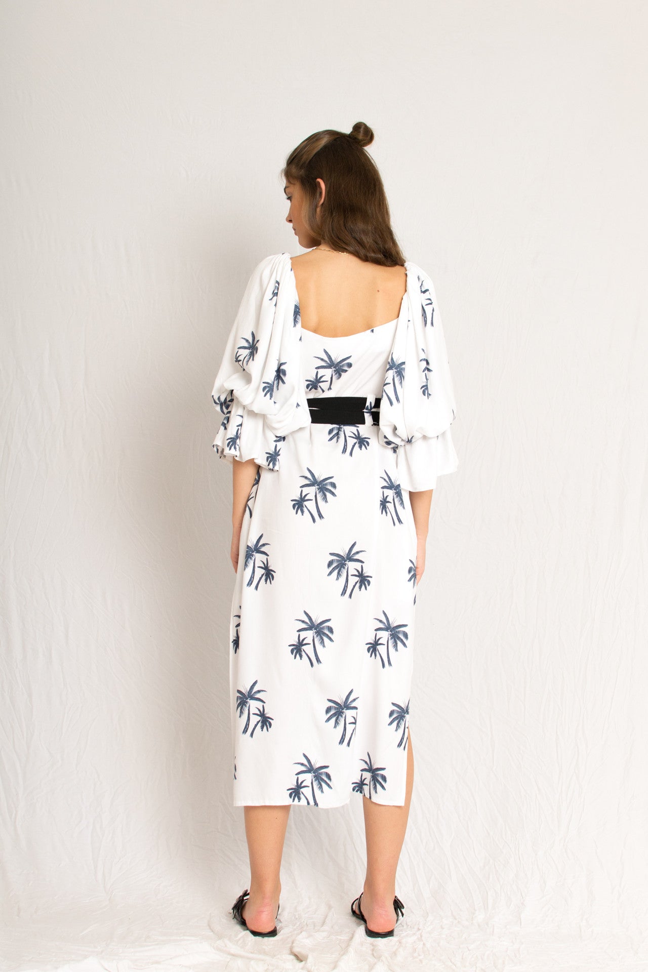 white midi palm tree print dress with side slits and peasant sleeves