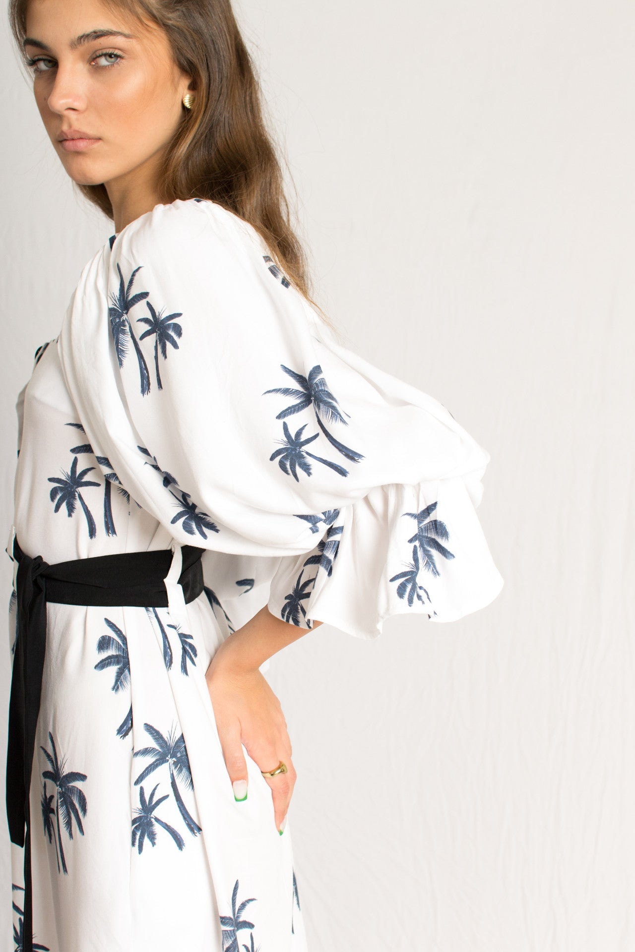 white midi palm tree print dress with side slits and peasant sleeves