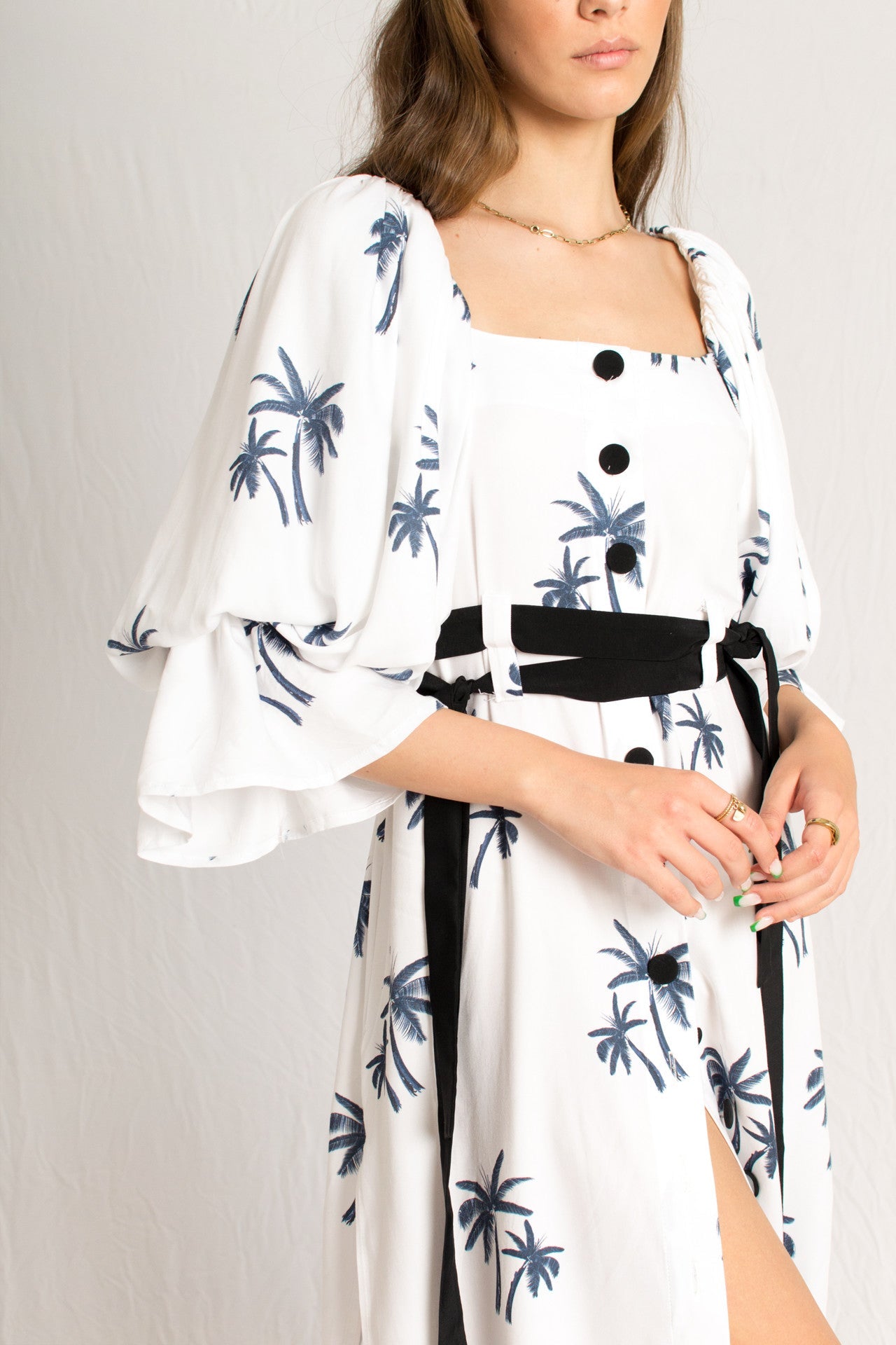 white midi palm tree print dress with side slits and peasant sleeves